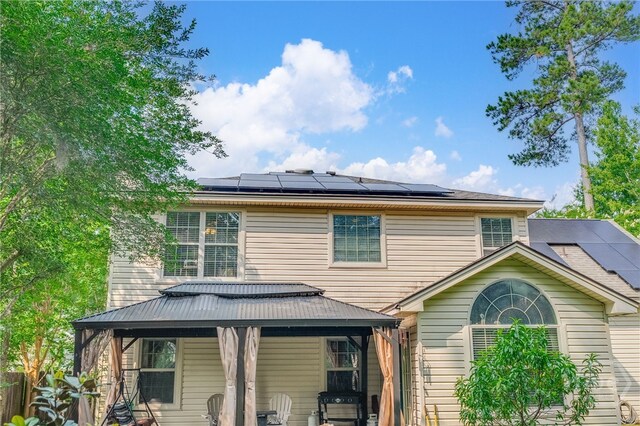 92 Shady Hill Cir, Richmond Hill, GA 31324 - rear view of house with roof mounted solar panels