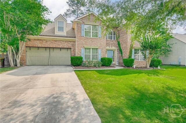 92 Shady Hill Cir, Richmond Hill, GA 31324 - view of front facade featuring a garage, driveway, a front lawn, and brick siding