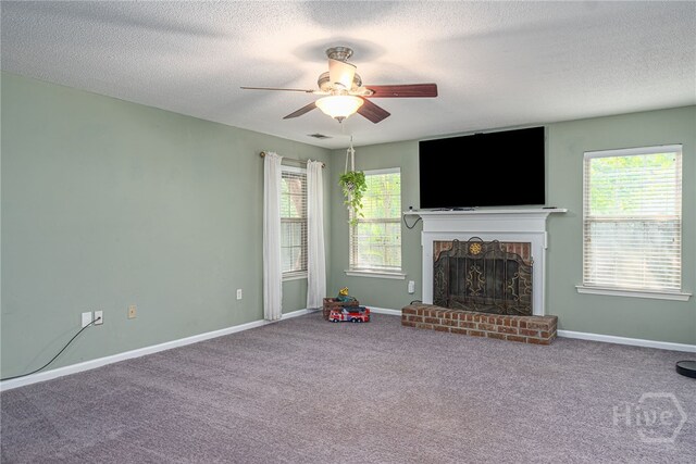 92 Shady Hill Cir, Richmond Hill, GA 31324 - unfurnished living room with a fireplace, ceiling fan, a textured ceiling, carpet, and baseboards