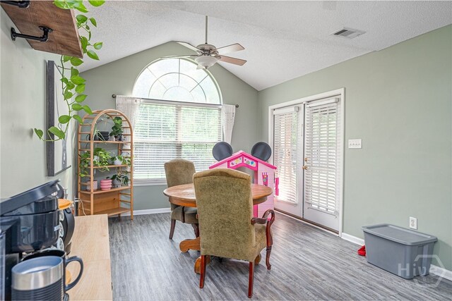 92 Shady Hill Cir, Richmond Hill, GA 31324 - dining area with wood finished floors, plenty of natural light, a ceiling fan, lofted ceiling, and baseboards