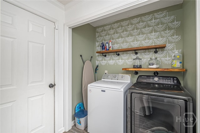92 Shady Hill Cir, Richmond Hill, GA 31324 - washroom featuring washer and clothes dryer, ornamental molding, and wood finished floors