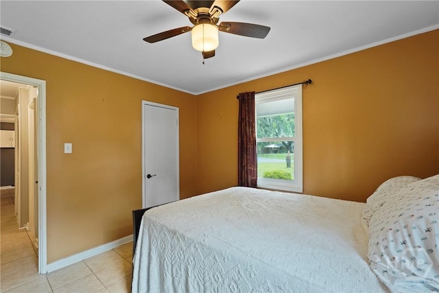 26 Arthur Cir, Savannah, GA 31406 - bedroom with ornamental molding, light tile patterned floors, baseboards, and ceiling fan
