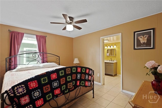 26 Arthur Cir, Savannah, GA 31406 - bedroom with light tile patterned floors, baseboards, connected bathroom, and a ceiling fan