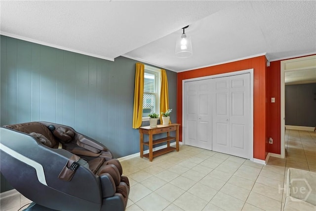 26 Arthur Cir, Savannah, GA 31406 - sitting room featuring a textured ceiling, light tile patterned floors, crown molding, baseboards, and wood walls