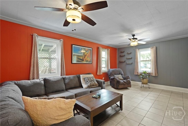 26 Arthur Cir, Savannah, GA 31406 - living room featuring a ceiling fan, crown molding, light tile patterned floors, baseboards, and wooden walls