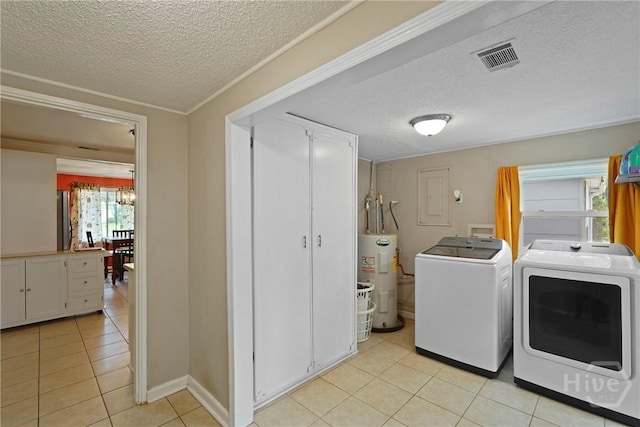 26 Arthur Cir, Savannah, GA 31406 - washroom featuring water heater, separate washer and dryer, a textured ceiling, light tile patterned floors, and electric panel
