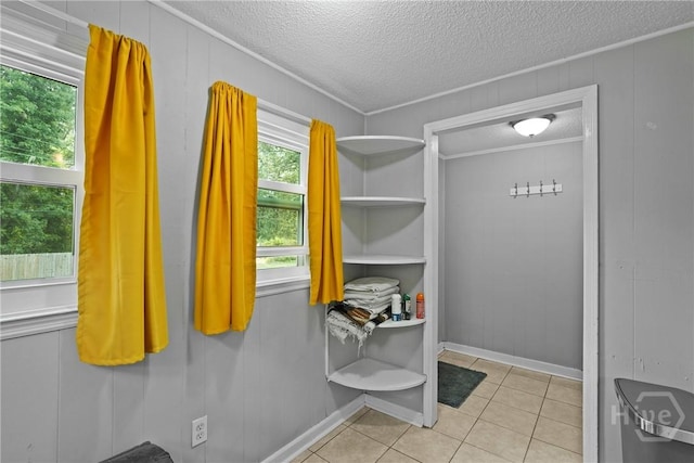 26 Arthur Cir, Savannah, GA 31406 - interior space with a textured ceiling, tile patterned floors, and a decorative wall