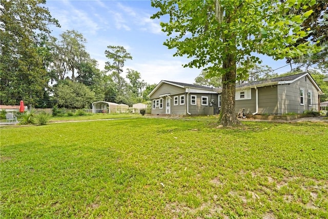 26 Arthur Cir, Savannah, GA 31406 - view of grassy yard featuring a carport
