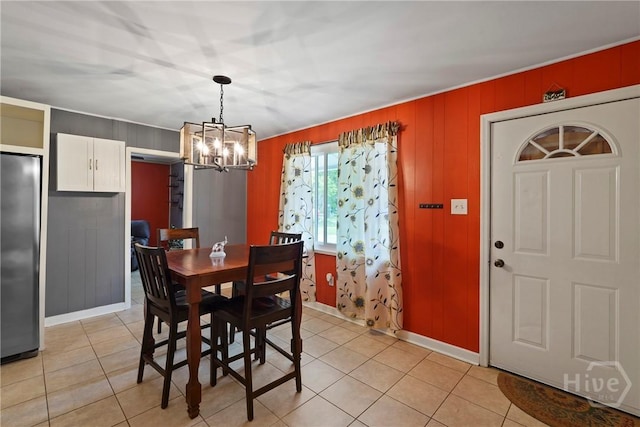 26 Arthur Cir, Savannah, GA 31406 - dining space featuring a chandelier, light tile patterned floors, and baseboards