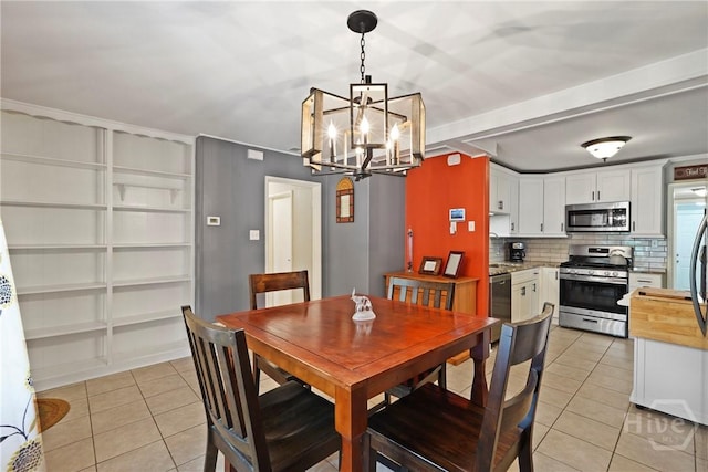 26 Arthur Cir, Savannah, GA 31406 - dining space featuring light tile patterned flooring and a chandelier