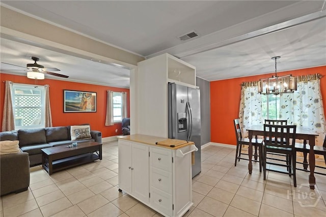 26 Arthur Cir, Savannah, GA 31406 - kitchen with stainless steel fridge with ice dispenser, white cabinetry, a chandelier, light tile patterned floors, and open floor plan