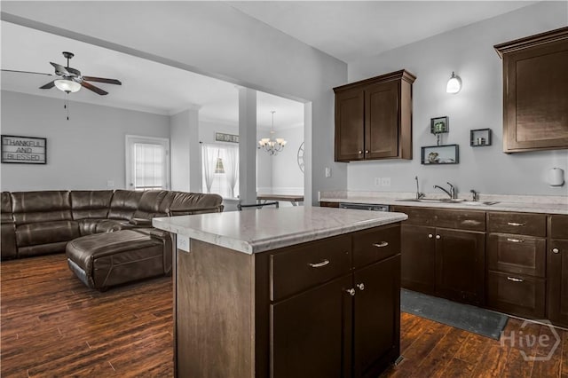673 Burke Dr, Hinesville, GA 31313 - kitchen featuring open floor plan, dark wood-style flooring, dark brown cabinetry, a sink, and a ceiling fan