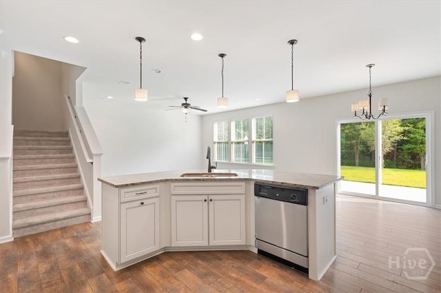 303 Waybridge Way, Richmond Hill, GA 31324 - kitchen with stainless steel dishwasher, a sink, dark wood-style floors, ceiling fan, and recessed lighting