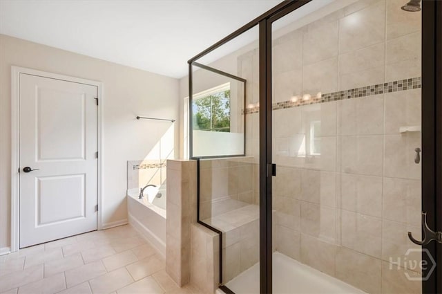 303 Waybridge Way, Richmond Hill, GA 31324 - bathroom with a garden tub, a stall shower, tile patterned flooring, and baseboards