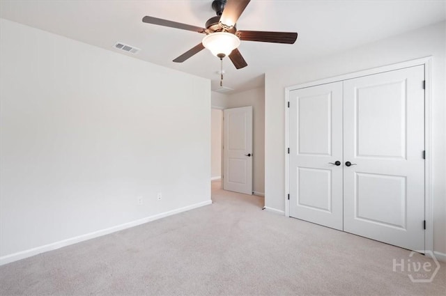 303 Waybridge Way, Richmond Hill, GA 31324 - unfurnished bedroom with light carpet, baseboards, a closet, and ceiling fan