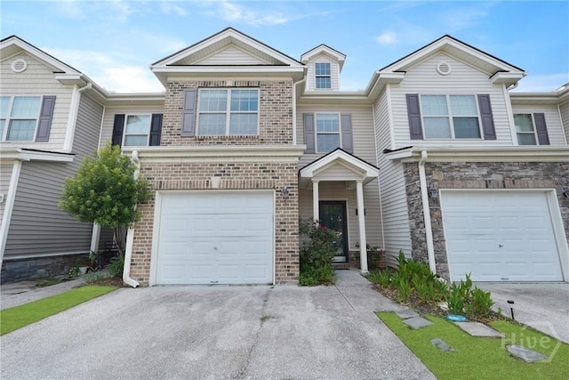 570 Canyon Oak Loop, Richmond Hill, GA 31324 - view of property with brick siding, an attached garage, and driveway