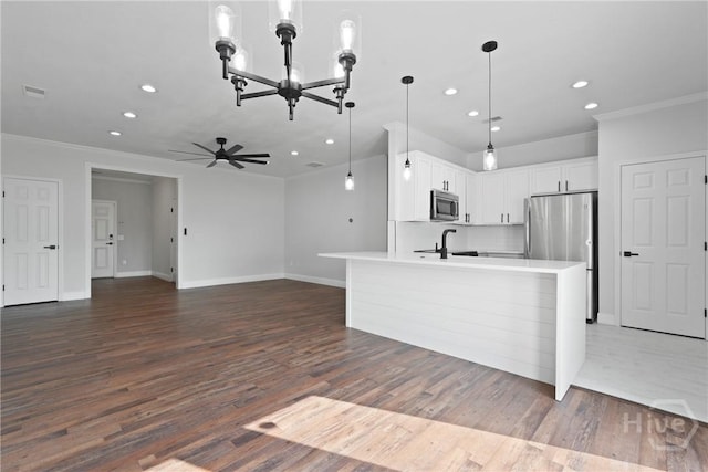 570 Canyon Oak Loop, Richmond Hill, GA 31324 - kitchen featuring appliances with stainless steel finishes, recessed lighting, crown molding, a chandelier, and light countertops