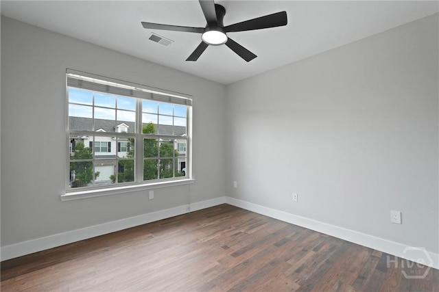 570 Canyon Oak Loop, Richmond Hill, GA 31324 - spare room featuring dark wood-style floors and baseboards