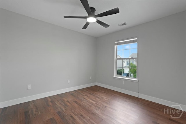 570 Canyon Oak Loop, Richmond Hill, GA 31324 - empty room featuring baseboards, dark wood finished floors, and ceiling fan