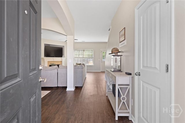 244 Murray Crossing Blvd NE, Ludowici, GA 31316 - hallway with dark wood finished floors, arched walkways, and baseboards