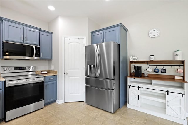 244 Murray Crossing Blvd NE, Ludowici, GA 31316 - kitchen with stainless steel appliances, blue cabinets, and light stone countertops