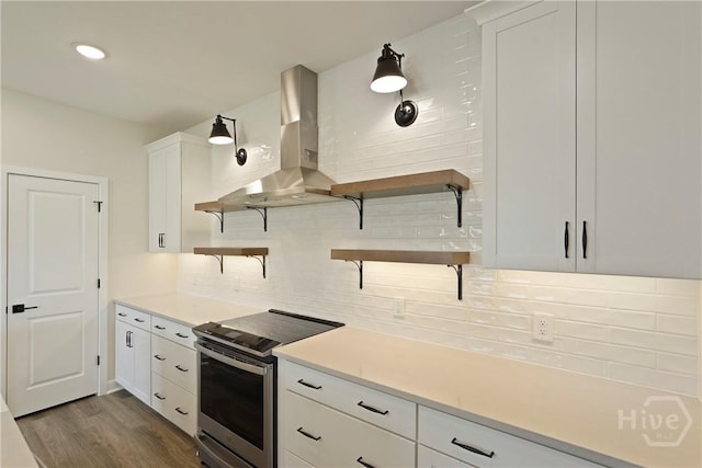 112 Mage St, Savannah, GA 31302 - kitchen with open shelves, stainless steel electric range oven, wall chimney exhaust hood, decorative backsplash, and white cabinetry