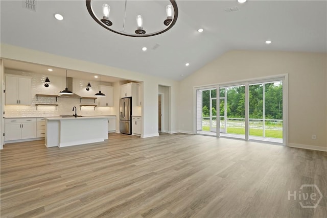 112 Mage St, Savannah, GA 31302 - unfurnished living room with a sink, light wood finished floors, baseboards, high vaulted ceiling, and recessed lighting