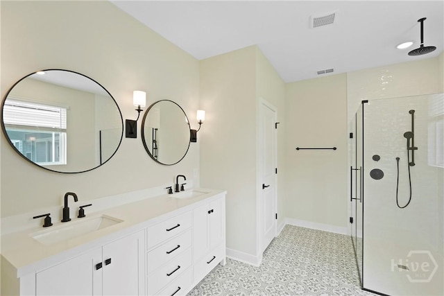 112 Mage St, Savannah, GA 31302 - bathroom featuring tiled shower, double vanity, baseboards, and tile patterned floors