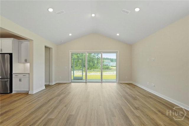 112 Mage St, Savannah, GA 31302 - unfurnished living room featuring vaulted ceiling, light wood-type flooring, and recessed lighting