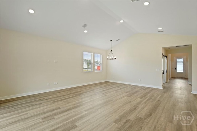 112 Mage St, Savannah, GA 31302 - unfurnished room with plenty of natural light, vaulted ceiling, light wood-style floors, recessed lighting, and a chandelier