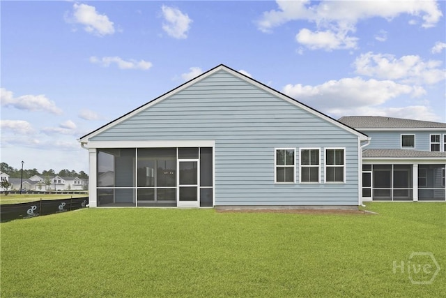 112 Mage St, Savannah, GA 31302 - rear view of house featuring a sunroom and a yard