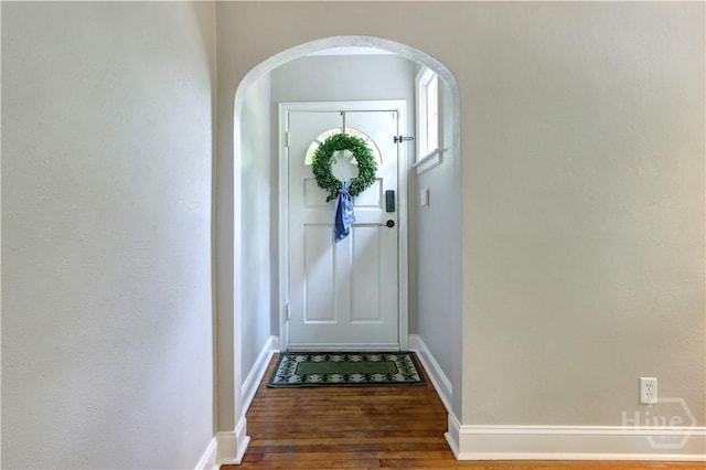 423 E 57th St, Savannah, GA 31405 - entryway featuring wood finished floors, arched walkways, and baseboards