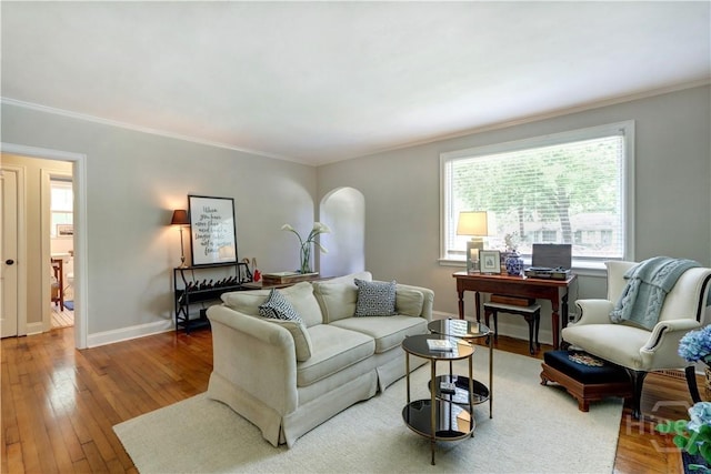 423 E 57th St, Savannah, GA 31405 - living room with ornamental molding, hardwood / wood-style flooring, and baseboards