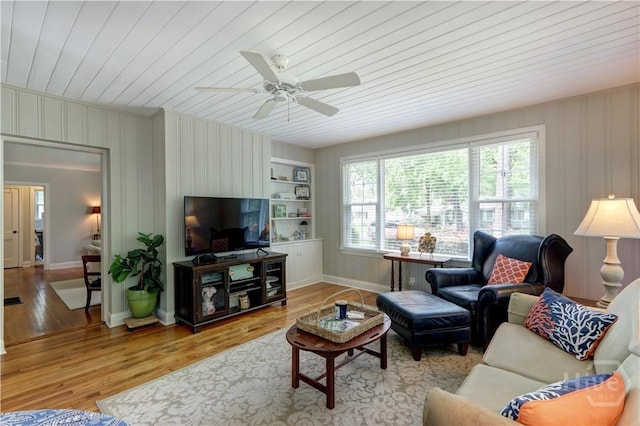 423 E 57th St, Savannah, GA 31405 - living room featuring wooden ceiling, a ceiling fan, wood finished floors, baseboards, and built in shelves