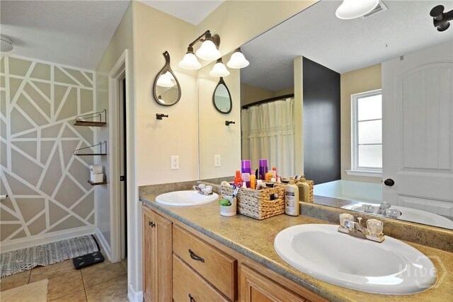 541 Deloach Rd NE, Ludowici, GA 31316 - bathroom with double vanity and tile patterned floors