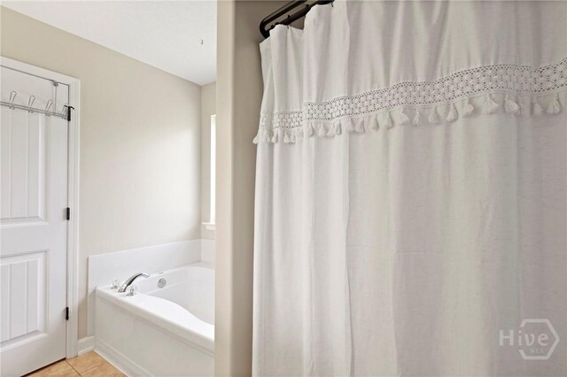 541 Deloach Rd NE, Ludowici, GA 31316 - full bathroom featuring a garden tub and tile patterned floors