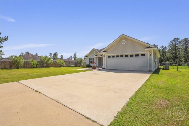 541 Deloach Rd NE, Ludowici, GA 31316 - view of front of house featuring concrete driveway, a garage, and central AC unit