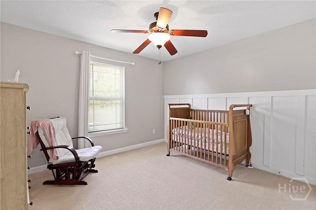 541 Deloach Rd NE, Ludowici, GA 31316 - bedroom with carpet flooring, a ceiling fan, and a crib