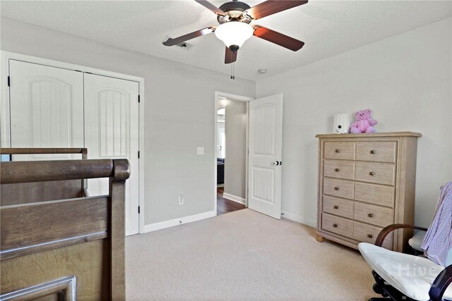 541 Deloach Rd NE, Ludowici, GA 31316 - bedroom featuring carpet floors, baseboards, ceiling fan, and a closet