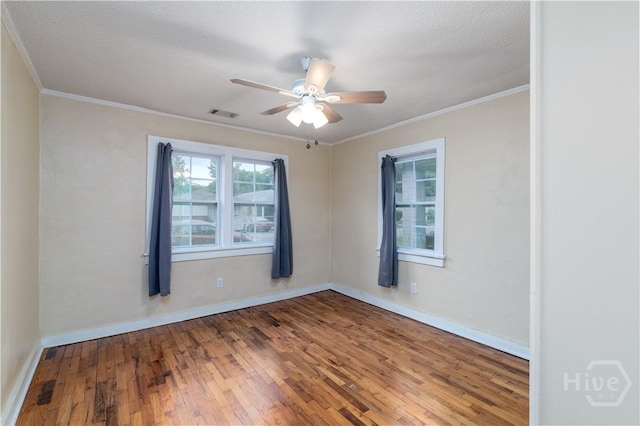 717 W 46th St, Savannah, GA 31405 - spare room featuring ornamental molding, wood-type flooring, a ceiling fan, and baseboards