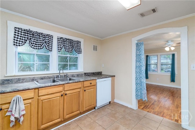 717 W 46th St, Savannah, GA 31405 - kitchen featuring white dishwasher, a sink, light tile patterned floors, crown molding, and dark countertops
