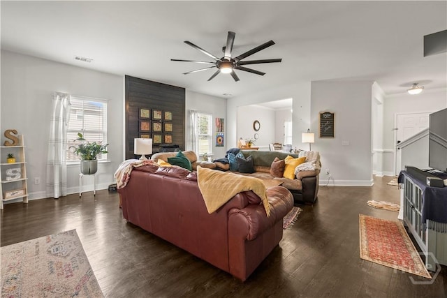 40 Saddlebrush Rd, Ellabell, GA 31308 - living area with a ceiling fan, healthy amount of natural light, dark wood-style floors, and baseboards