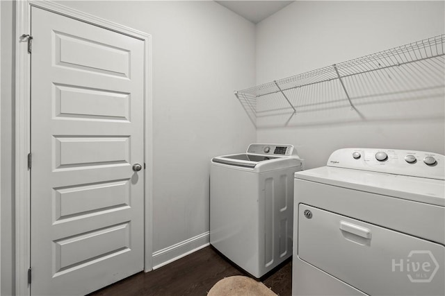 40 Saddlebrush Rd, Ellabell, GA 31308 - laundry room featuring washing machine and clothes dryer, dark wood-style flooring, and baseboards
