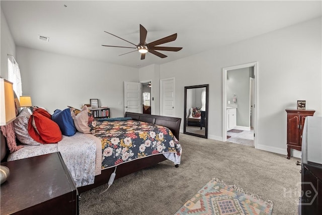 40 Saddlebrush Rd, Ellabell, GA 31308 - bedroom with carpet floors, baseboards, ceiling fan, and connected bathroom