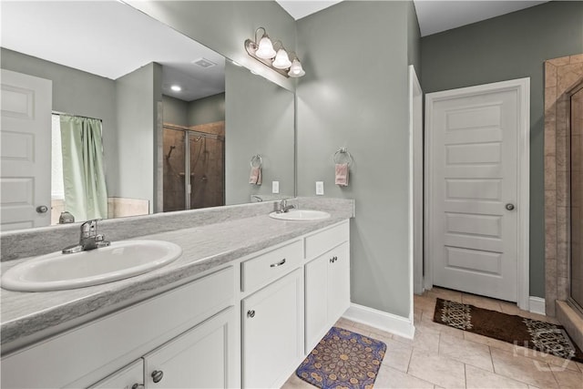 40 Saddlebrush Rd, Ellabell, GA 31308 - bathroom featuring a shower stall, double vanity, baseboards, and tile patterned flooring