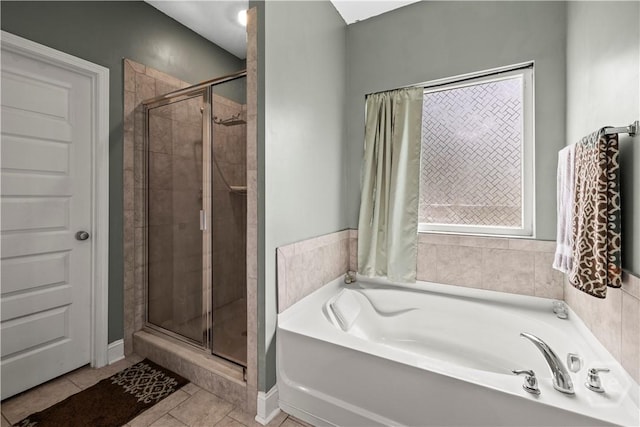 40 Saddlebrush Rd, Ellabell, GA 31308 - full bathroom with a garden tub, a stall shower, and tile patterned floors