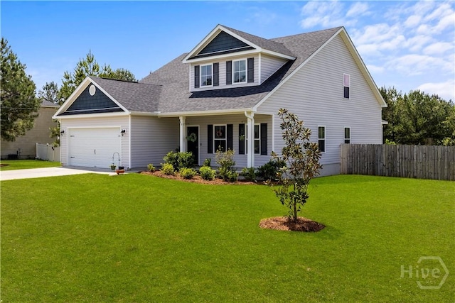 40 Saddlebrush Rd, Ellabell, GA 31308 - traditional-style house featuring a shingled roof, an attached garage, concrete driveway, and covered porch