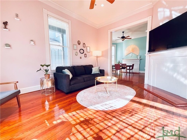 2203 Barnard St, Savannah, GA 31401 - living area featuring a ceiling fan, wood finished floors, crown molding, and baseboards