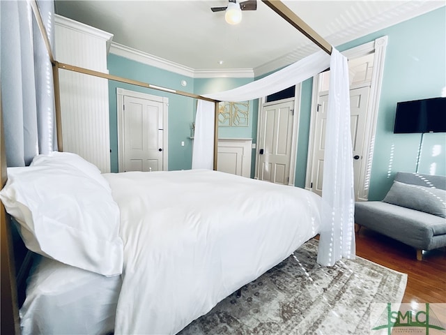 2203 Barnard St, Savannah, GA 31401 - bedroom with crown molding, wood finished floors, multiple closets, and ceiling fan