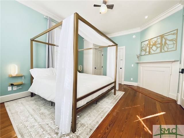 2203 Barnard St, Savannah, GA 31401 - bedroom with ornamental molding, baseboards, wood finished floors, and ceiling fan